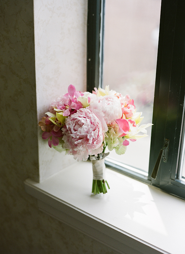 light and dark pink bouquet in a window - sweet southern military style wedding photo by Charleston wedding photographer Virgil Bunao
